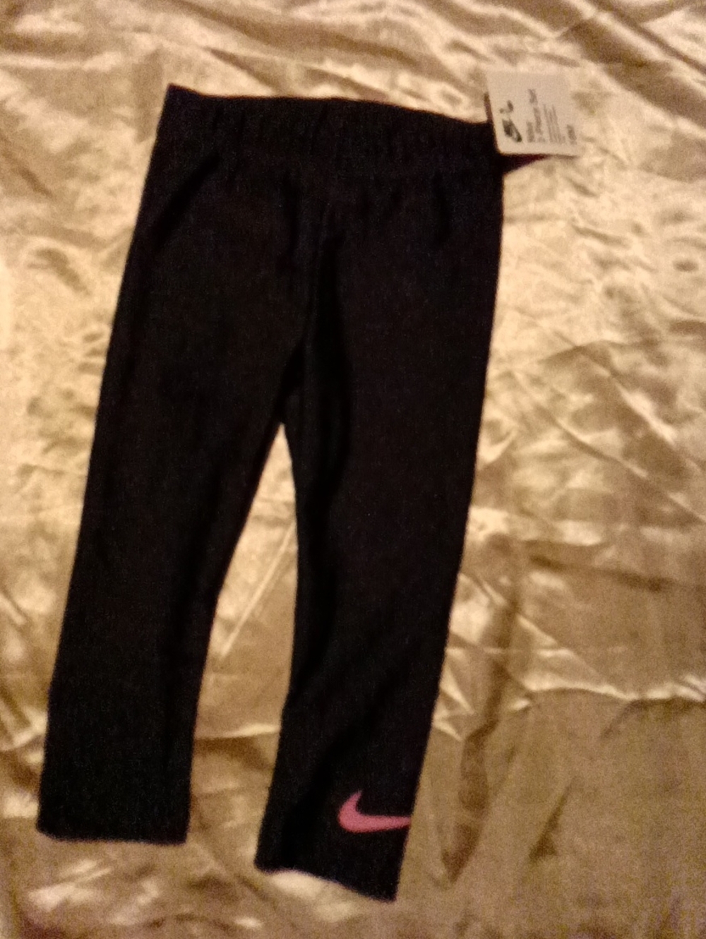 Nike Kids Black Leggings with Pink Swoosh Detail
